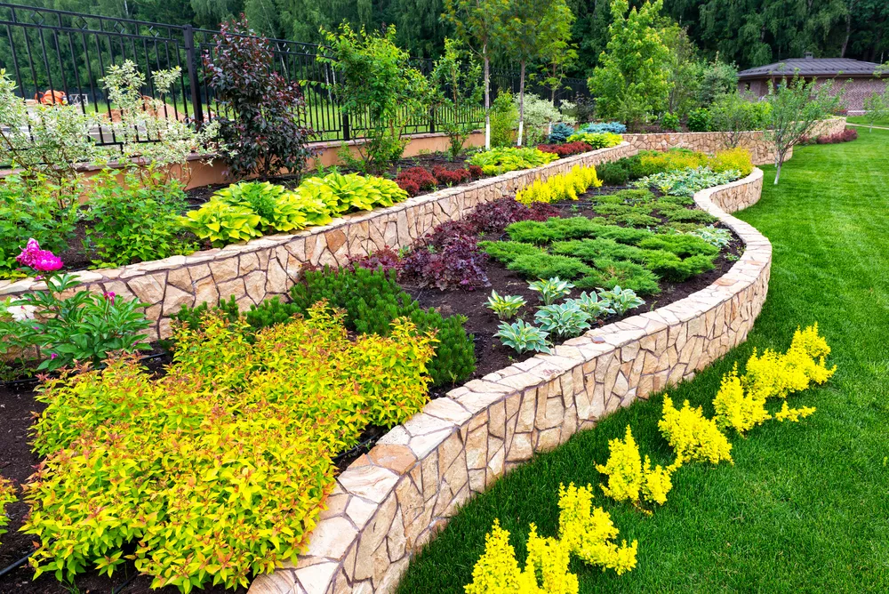 Beautiful landscape design with stone walls and colorful plantings